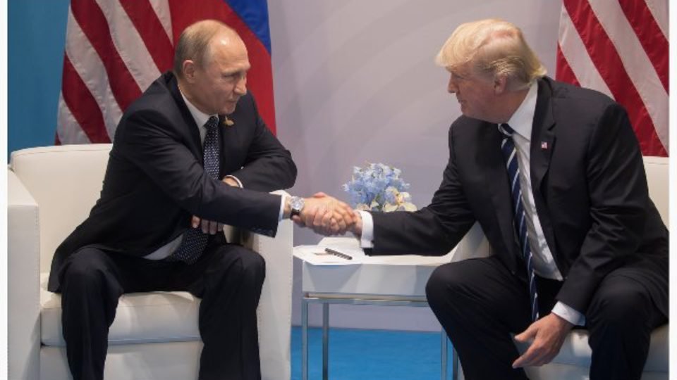 Russian President Putin on left meets US President Trump