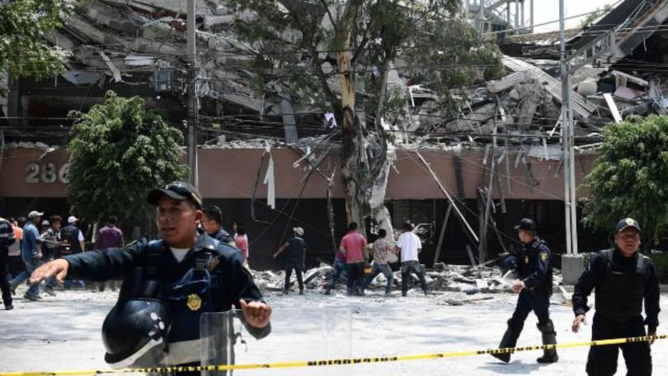 An injured woman is pictured in Mexico City after a 7dot1 magnitude earthquake Pic AFP