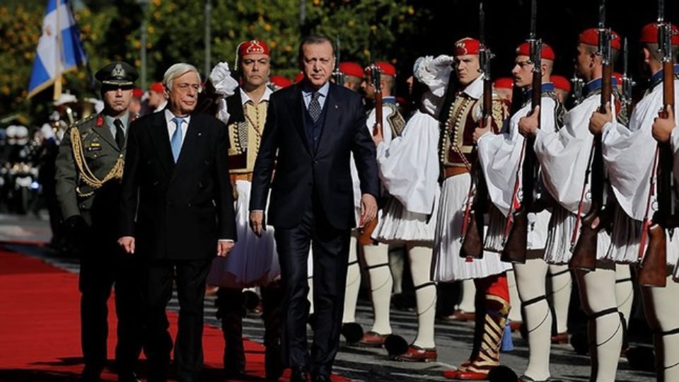 Greek President Prokopis Pavlopoulos and his Turkish counterpart Tayyip Erdogan inspect a guard of honour during a welcome ceremony in Athens, Greece December 7, 2017.