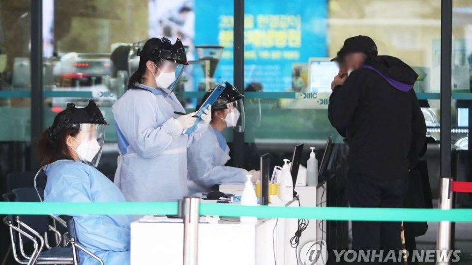 Medical workers check a visitor at Bundang Jesaeng Hospital in Seongnam, south of Seoul, on April 17, 2020 Pic Yonhap