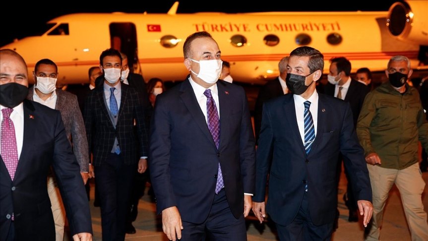 Turkish Foreign Minister Mevlut Cavusoglu welcomed by TRNC Foreign Minister Tahsin Ertugruloglu at Ercan Airport, Nicosia, April 15, 2021.Anadolu News